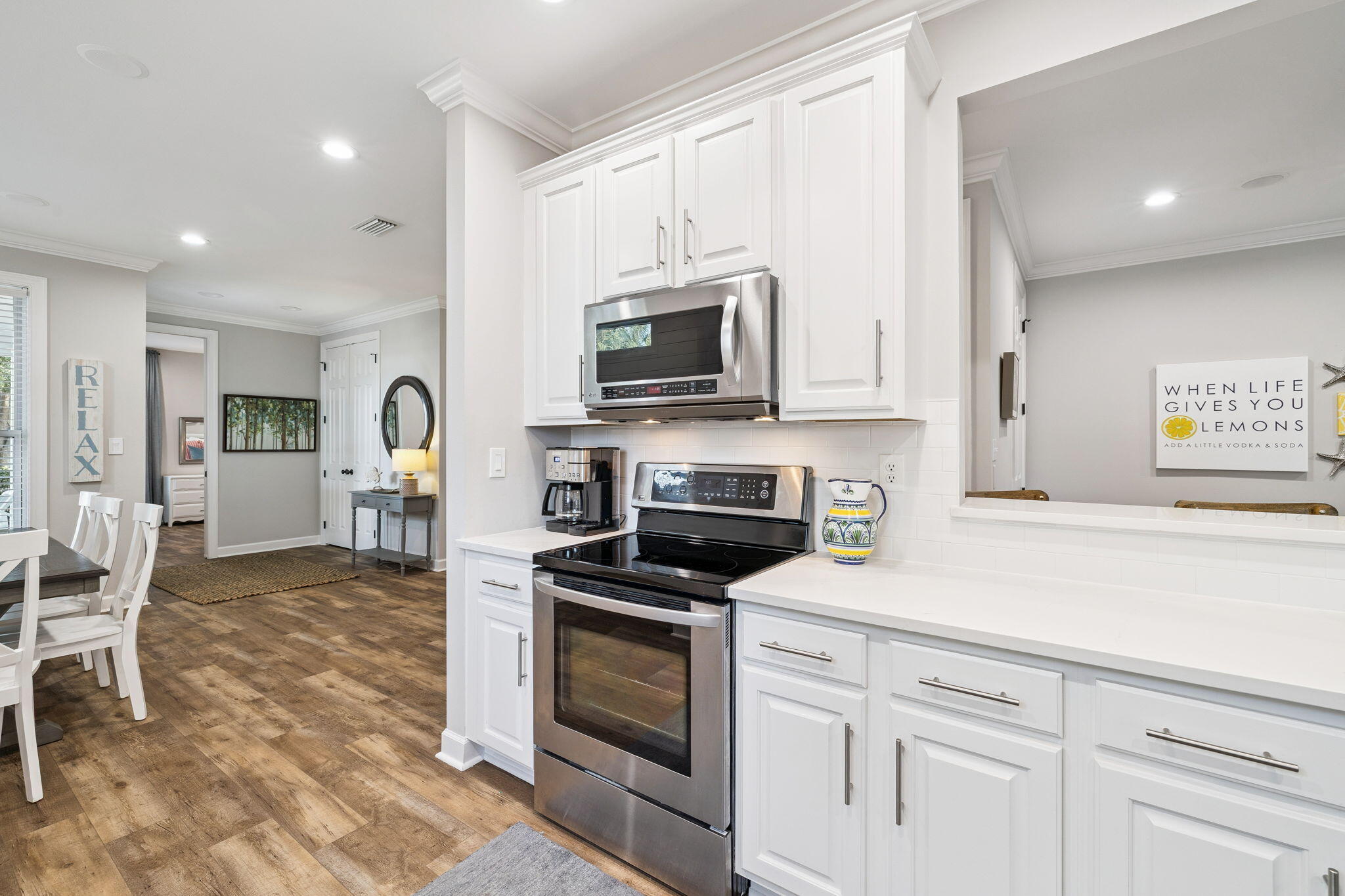 1994 Shannons Cove Miramar Beach, FL 32550 - Photo 12 of 44 a kitchen with granite countertop a stove top oven microwave and cabinets