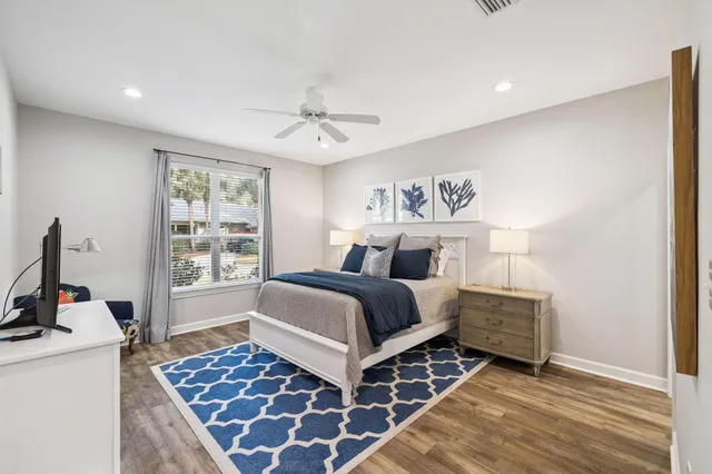 a bedroom with a bed and a table in it