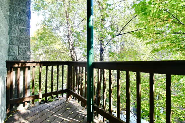 a view of balcony with wooden floor