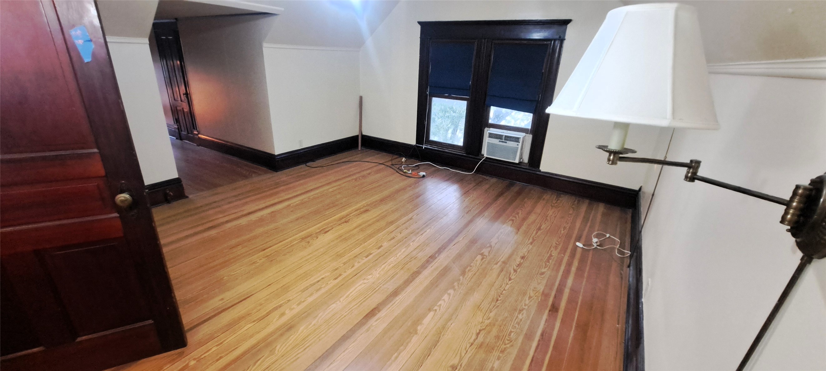 105 Davis Drive Thorndale, TX 76577 - Photo 10 of 21 Gleaming hardwood floors run throughout this top-floor room accented by classic dark wood trim.