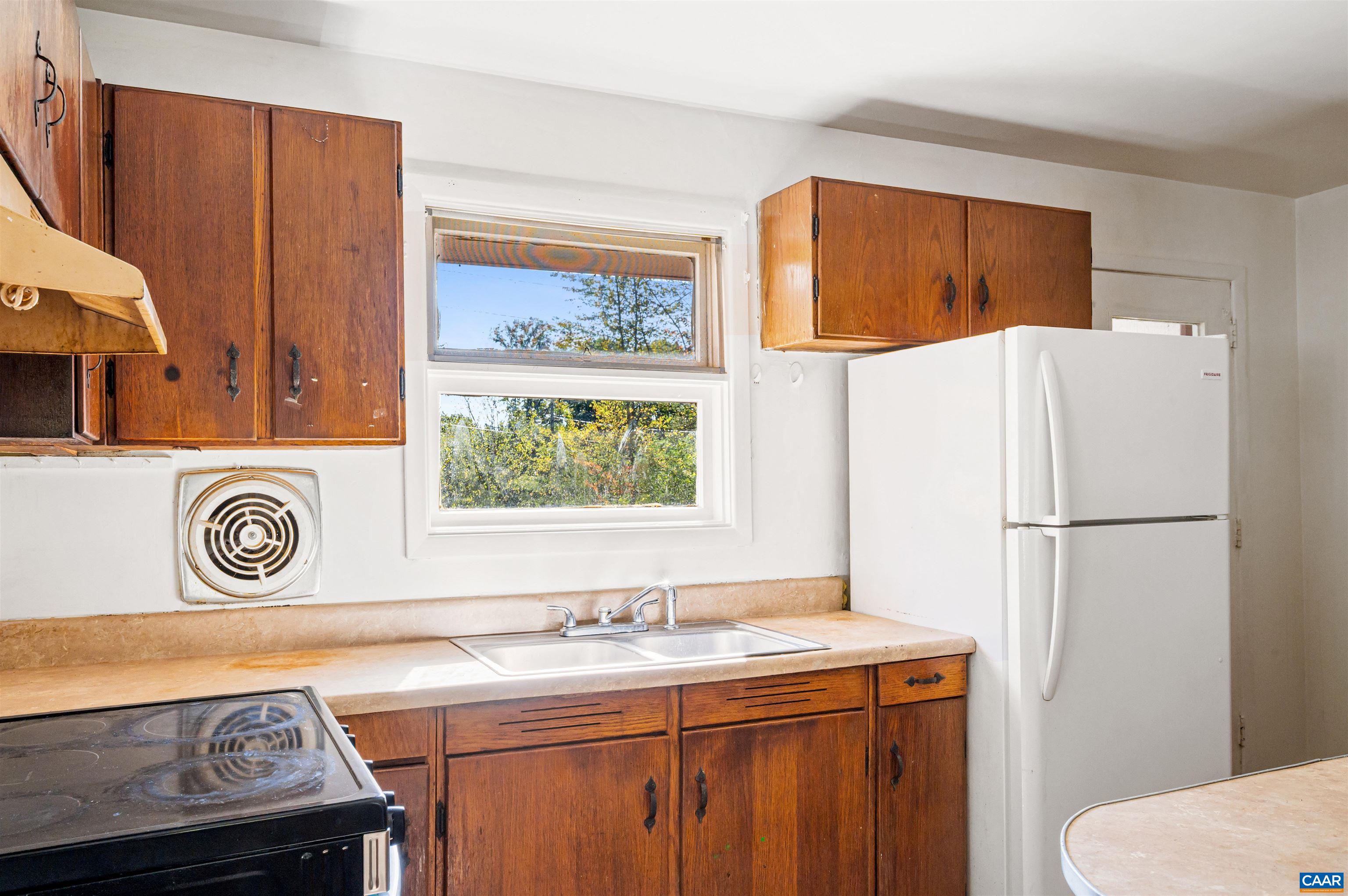 2302 Summit Road Charlottesville, VA 22901 - Photo 13 of 39 a kitchen with stainless steel appliances a refrigerator and a sink