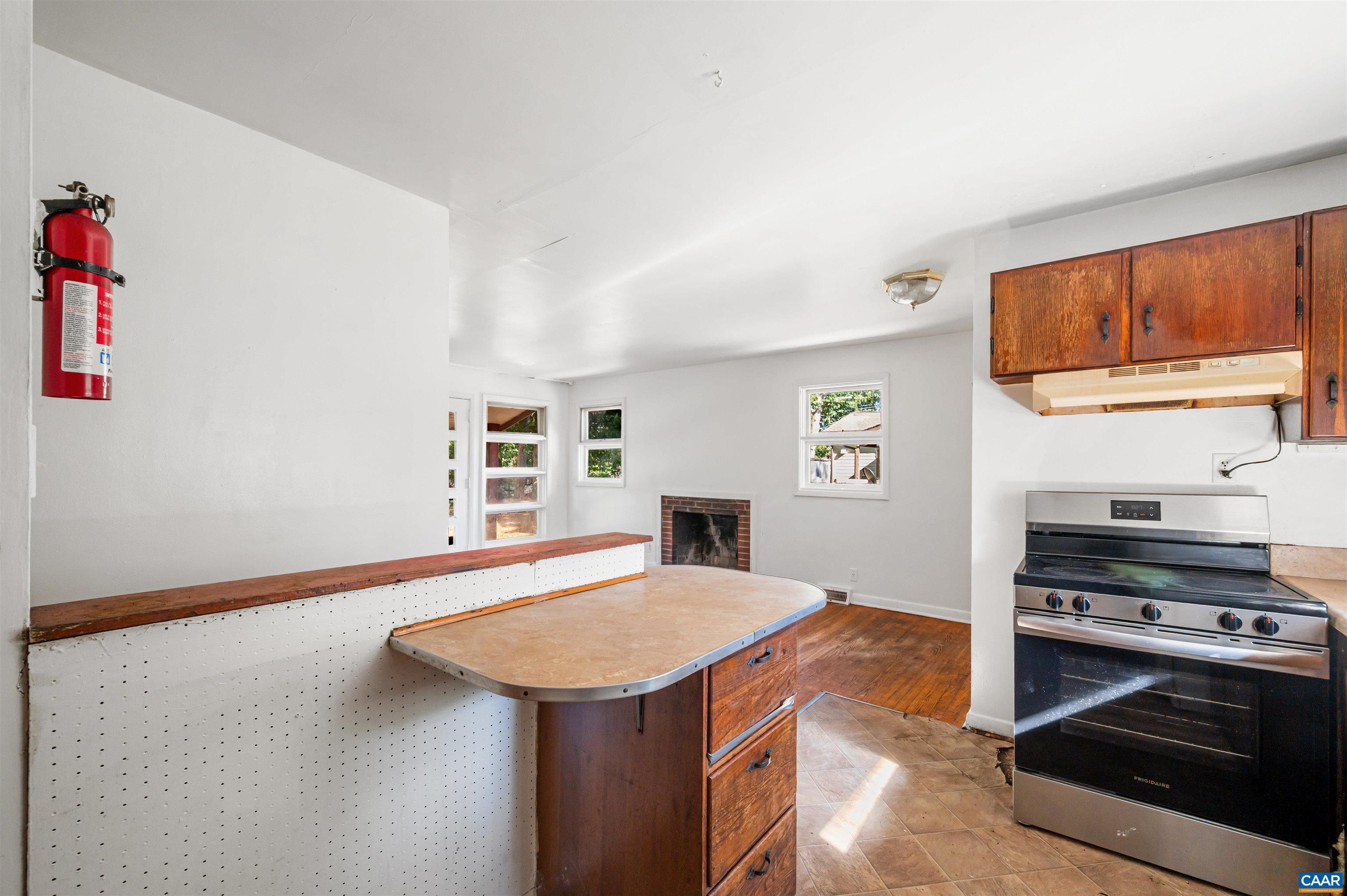2302 Summit Road Charlottesville, VA 22901 - Photo 16 of 39 a kitchen with a stove and a refrigerator