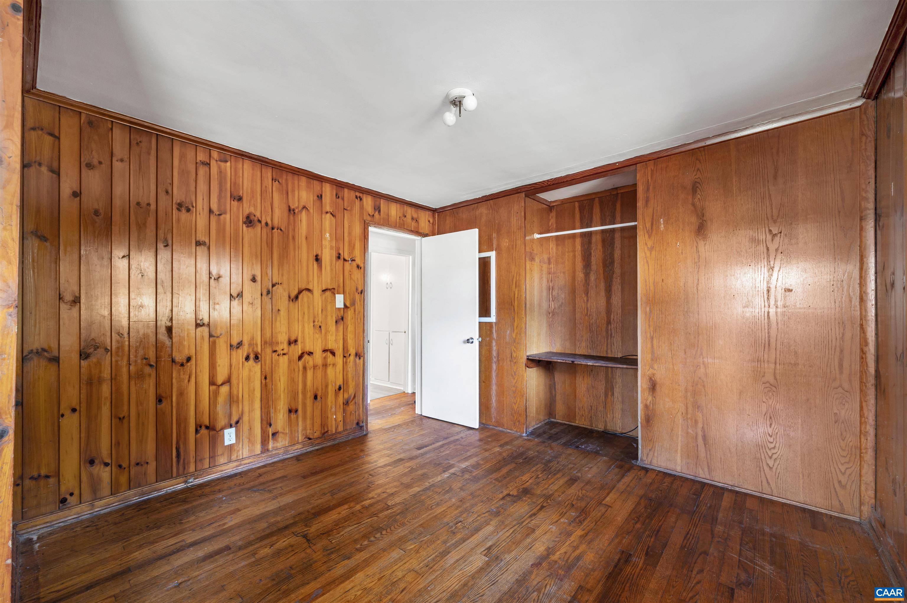 2302 Summit Road Charlottesville, VA 22901 - Photo 19 of 39 a view of an empty room with wooden floor and a window