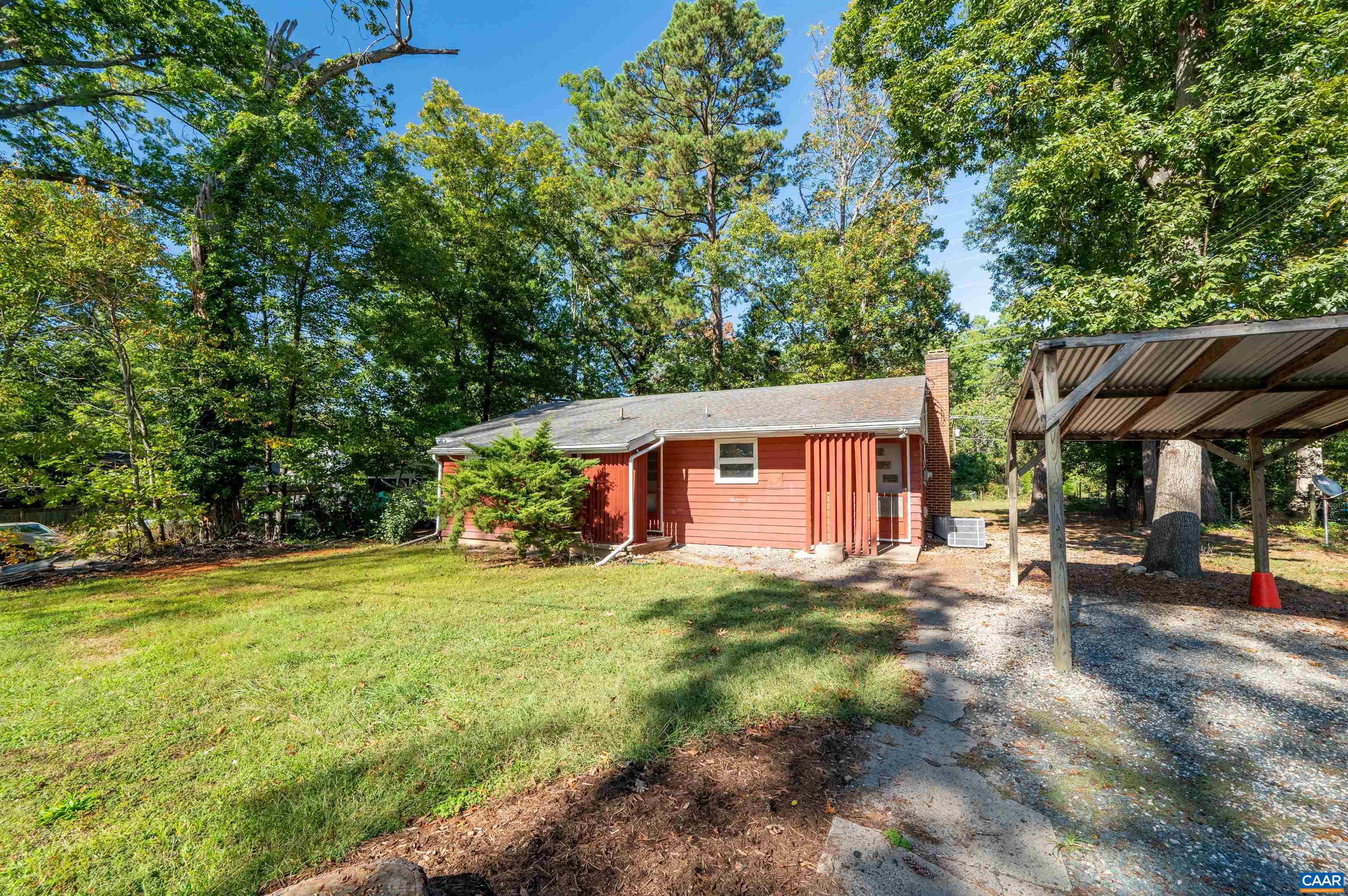 2302 Summit Road Charlottesville, VA 22901 - Photo 2 of 39 a front view of a house with a yard and garage