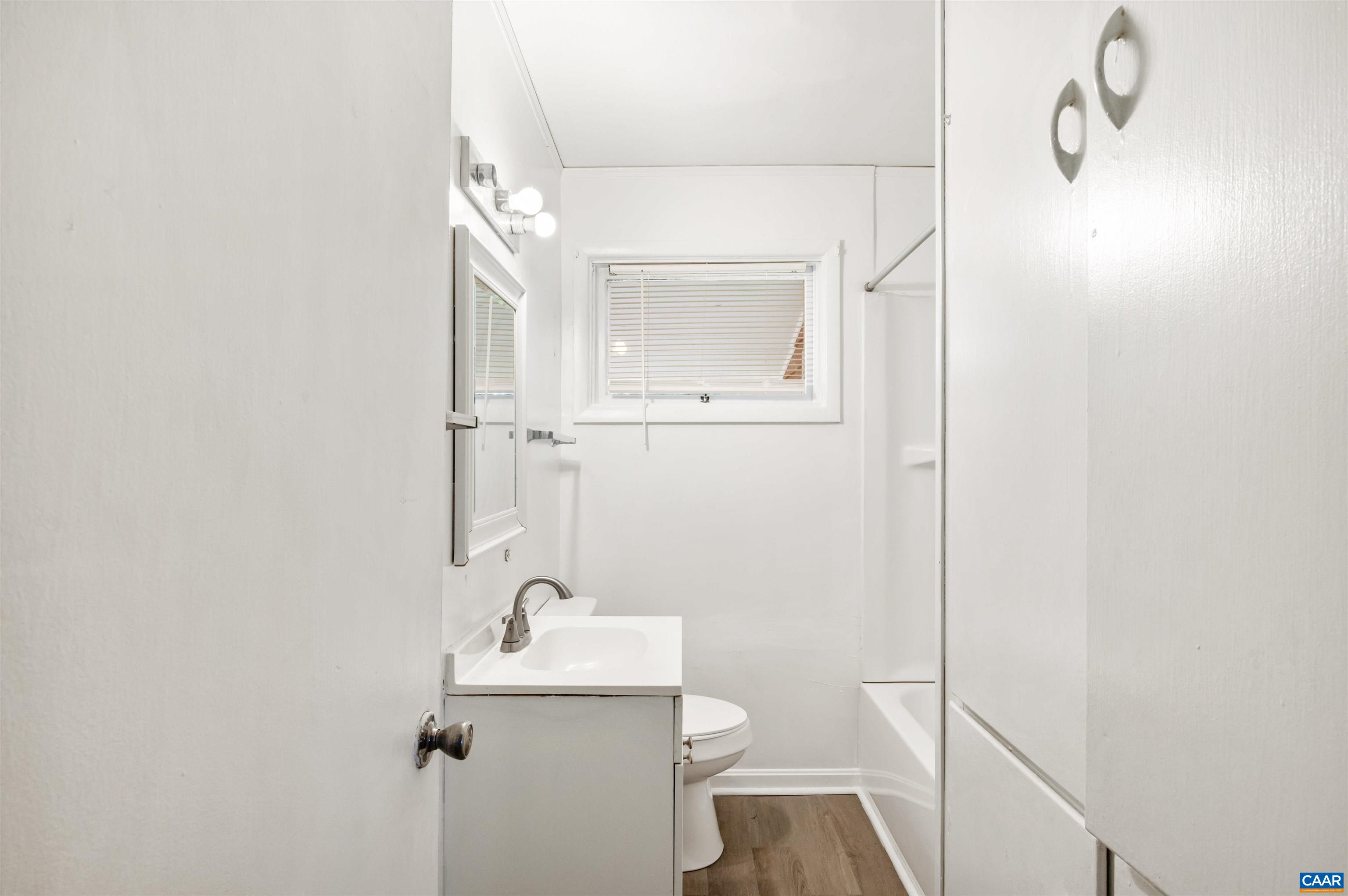 2302 Summit Road Charlottesville, VA 22901 - Photo 23 of 39 a bathroom with a sink a toilet and shower