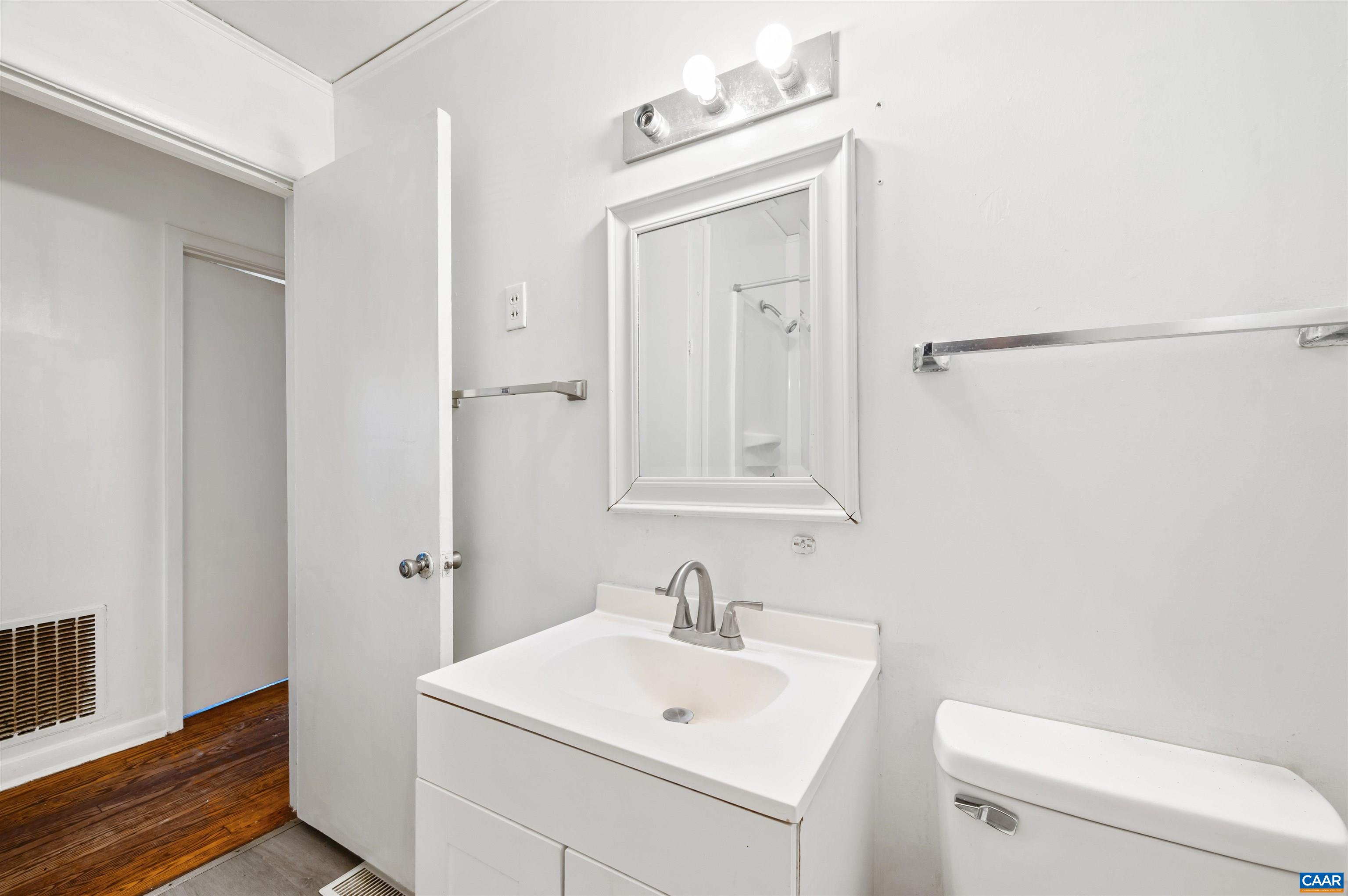 2302 Summit Road Charlottesville, VA 22901 - Photo 24 of 39 a bathroom with a sink a toilet and a mirror