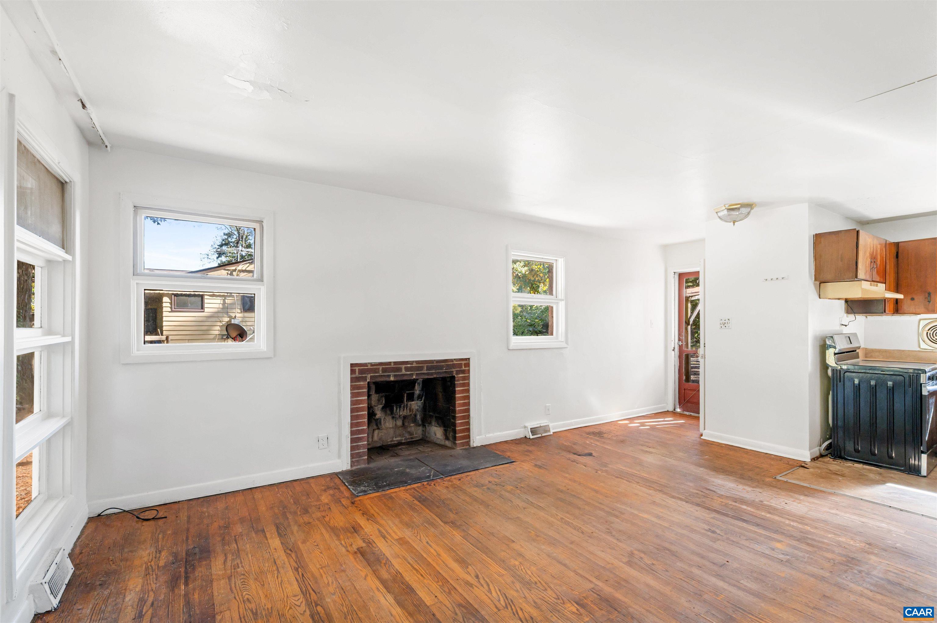 2302 Summit Road Charlottesville, VA 22901 - Photo 10 of 39 a bedroom with a bed and a fireplace