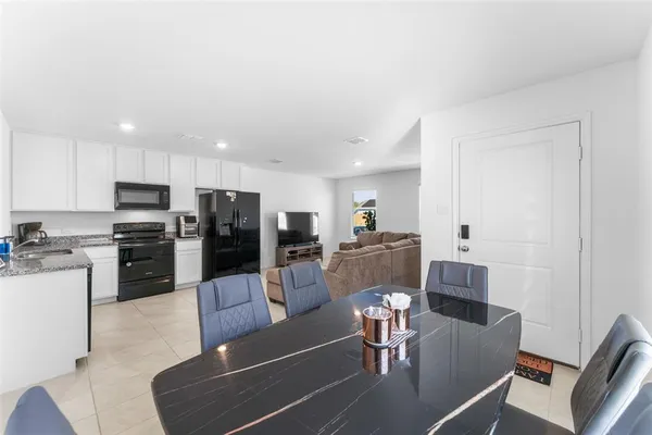a view of a dining room with furniture