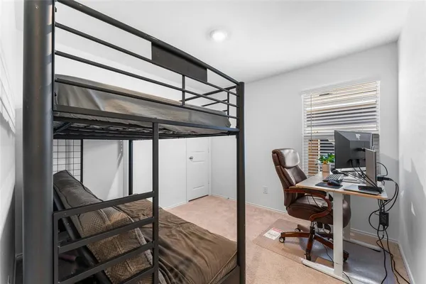 a work room with furniture and a window