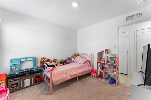 a bedroom with furniture and a bed