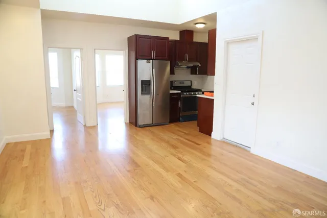 a kitchen with stainless steel appliances a refrigerator and a stove