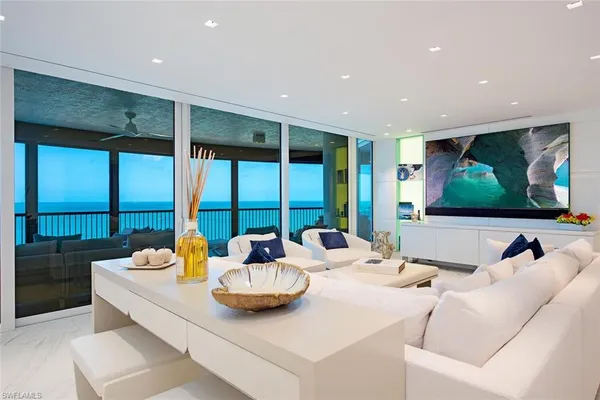 a living room with furniture and a large window