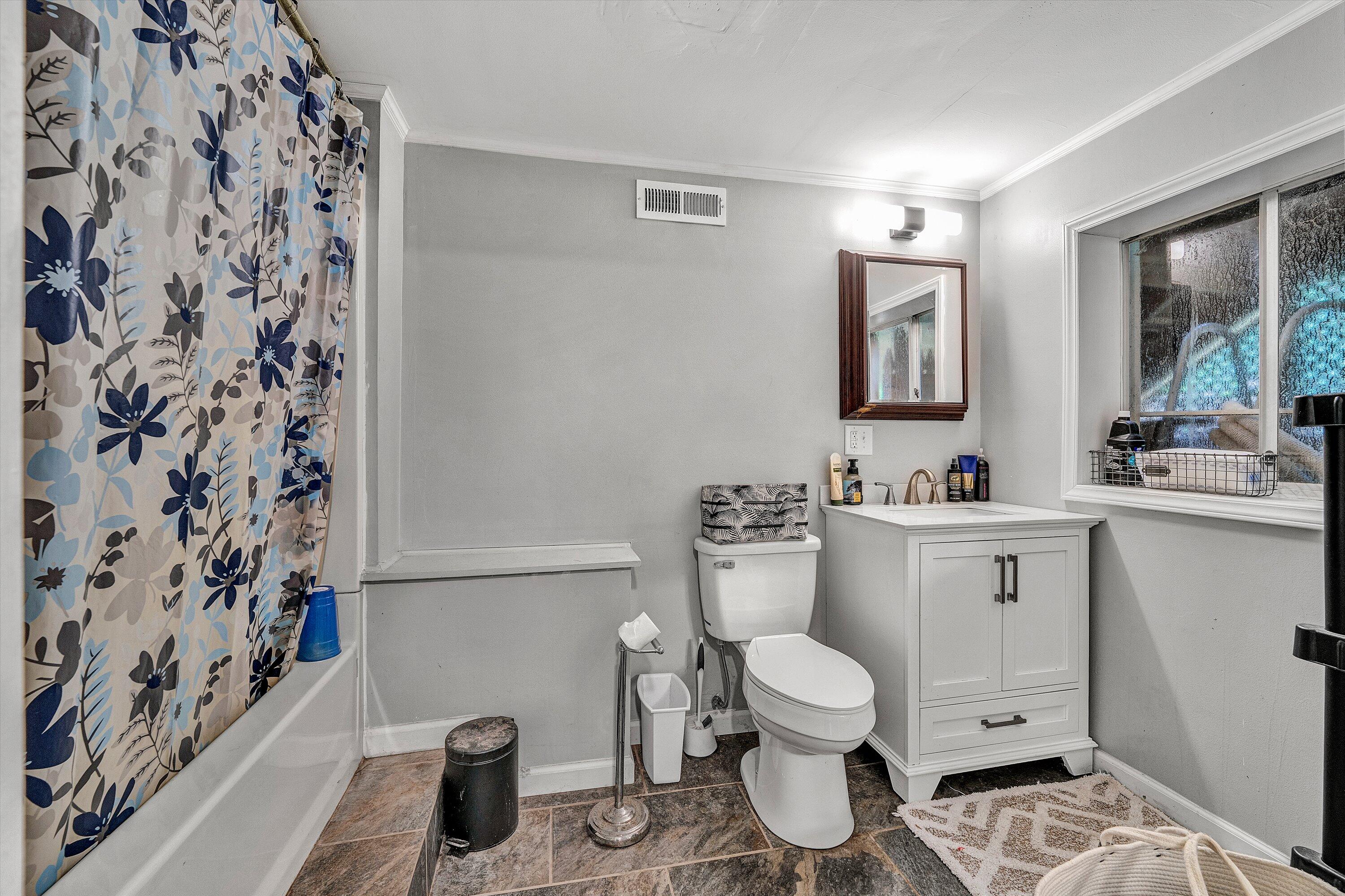 2095 Webster Road Glade Hill, VA 24092 - Photo 13 of 20 a bathroom with a toilet sink and mirror