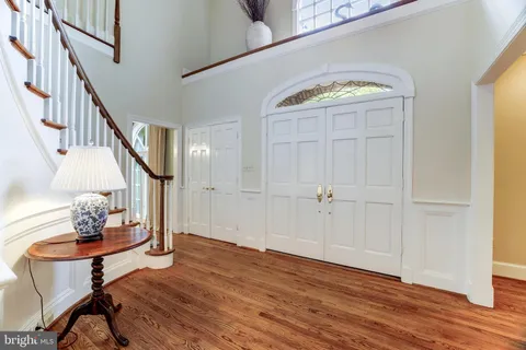 a view of an entryway with wooden floor