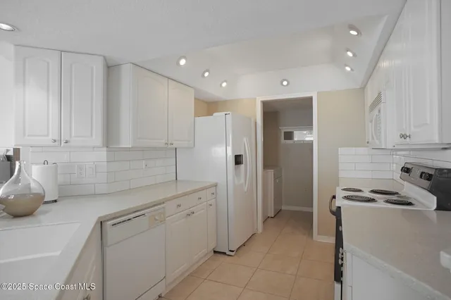 a kitchen with a sink stainless steel appliances and cabinets