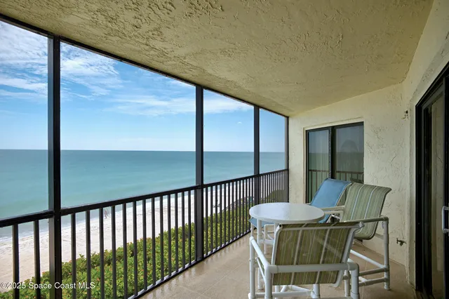 a view of a balcony with chair