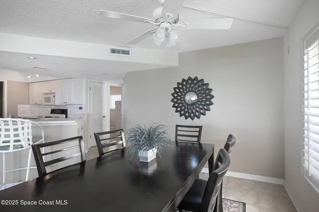 a view of kitchen and dining room with furniture