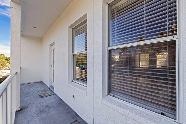 a view of wooden door and a porch