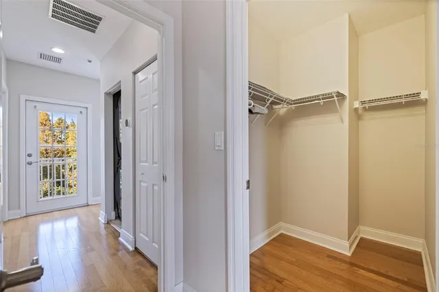 a view of an entryway with wooden floor