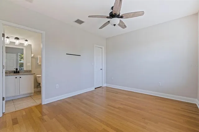 a view of a kitchen with a white cabinet and a stove top oven