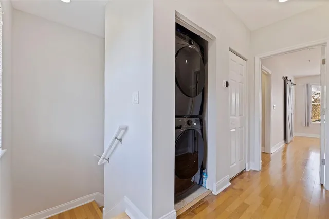 a view of hallway with wooden floor