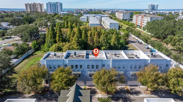 an aerial view of a house with a garden