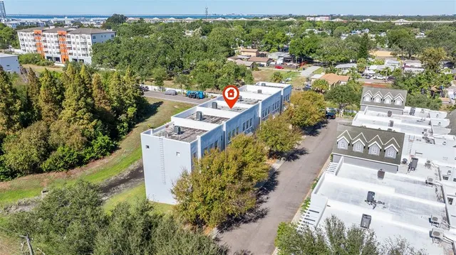 an aerial view of a house with outdoor space