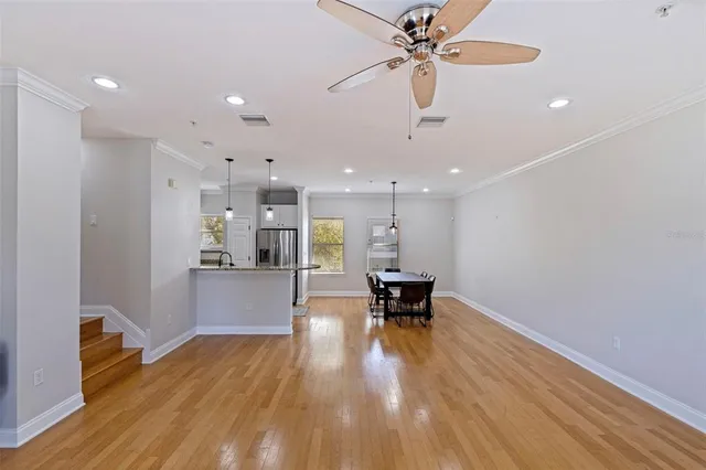 a view of kitchen with cabinets and wooden floor