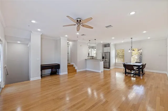a view of kitchen with cabinets and table