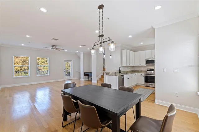 a kitchen with a table and chairs in it