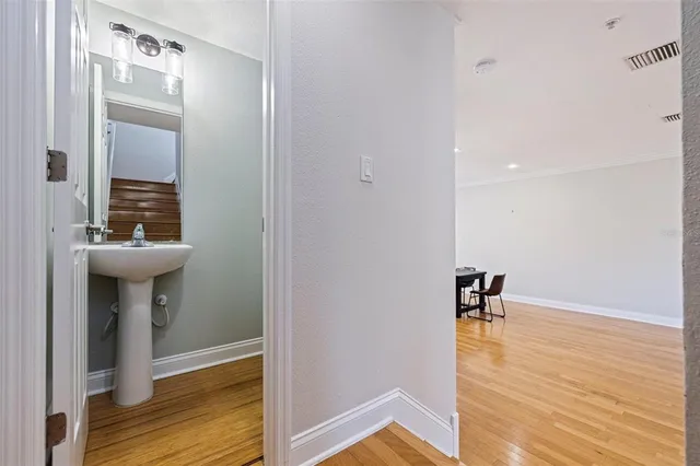a view of bathroom with a sink mirror and toilet