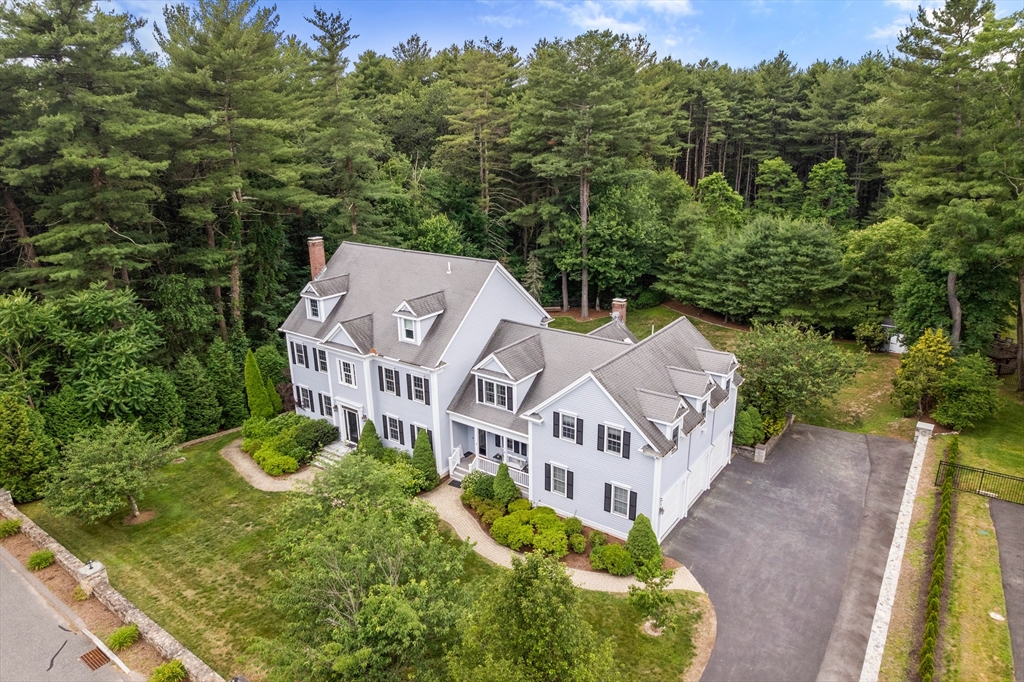 an aerial view of a house with a garden
