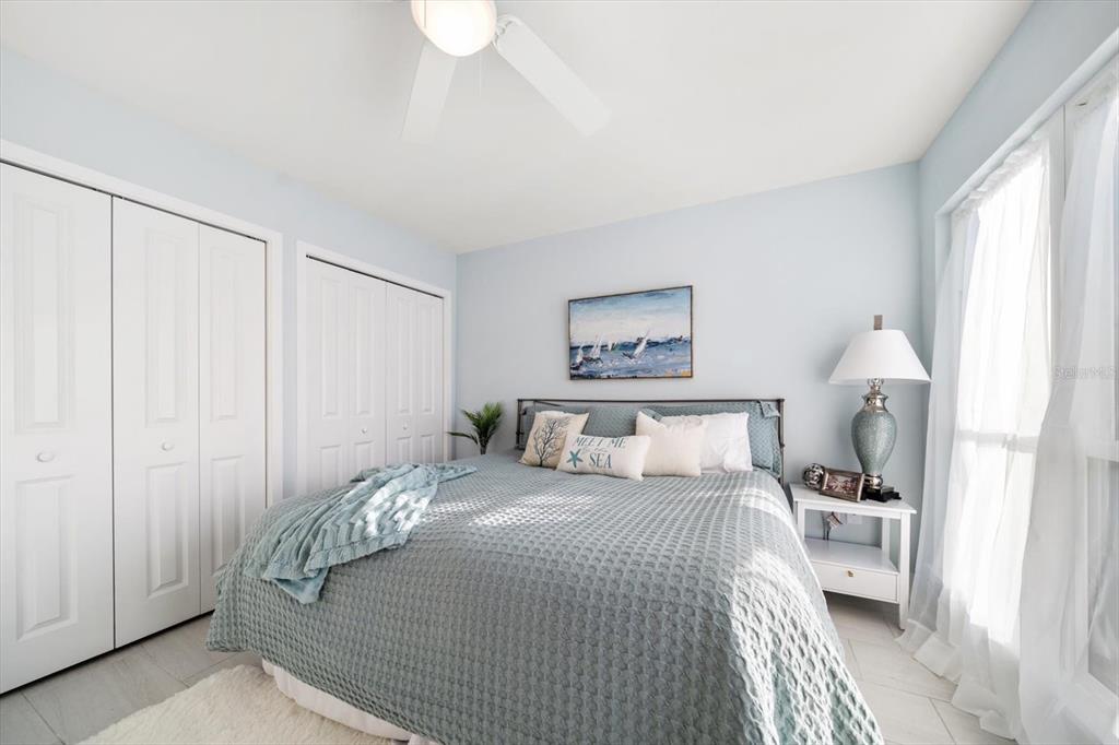 1 Windrush Boulevard, Unit 45 Indian Rocks Beach, FL 33785 - Photo 27 of 53 a bedroom with a bed and a window