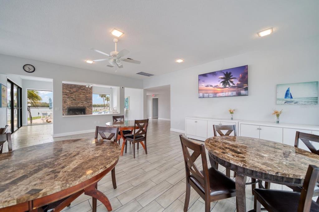 1 Windrush Boulevard, Unit 45 Indian Rocks Beach, FL 33785 - Photo 41 of 53 a view of a dining room with furniture window and wooden floor