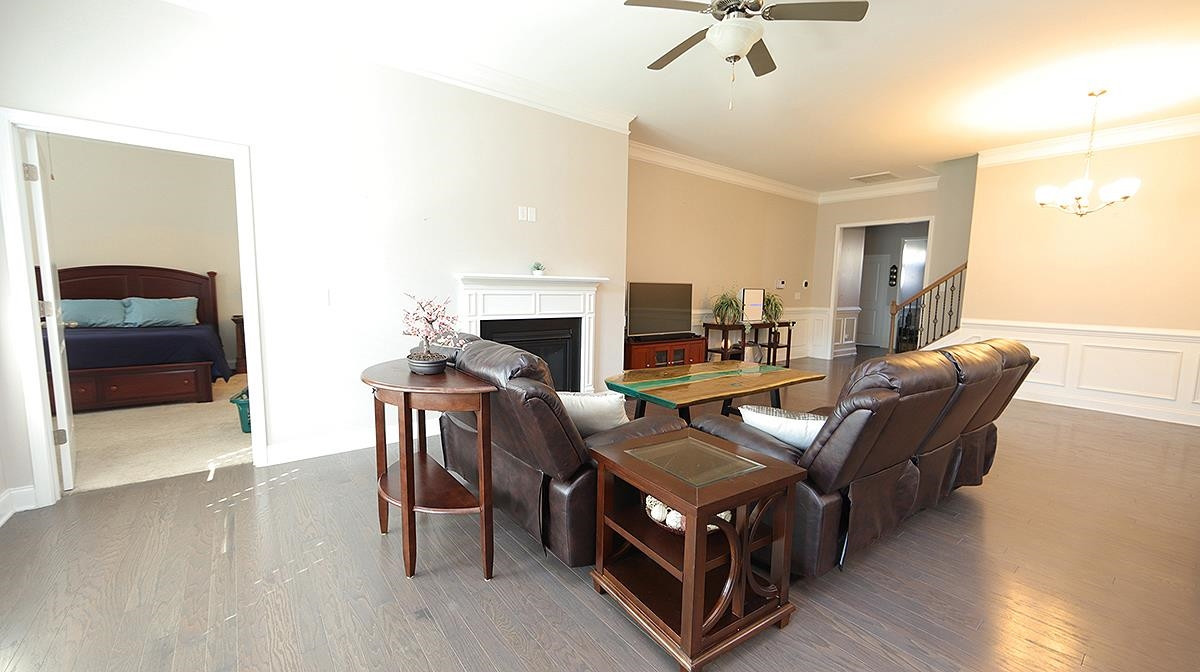 7524 Oakberry Drive Raleigh, NC 27616 - Photo 3 of 22 Gas fireplace and open living make this space a great place to unwind Living Room