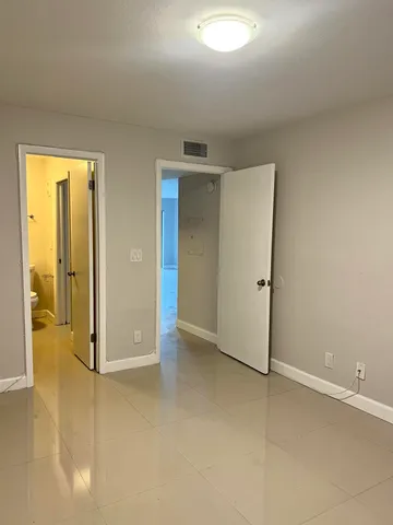 an empty room with a bathroom