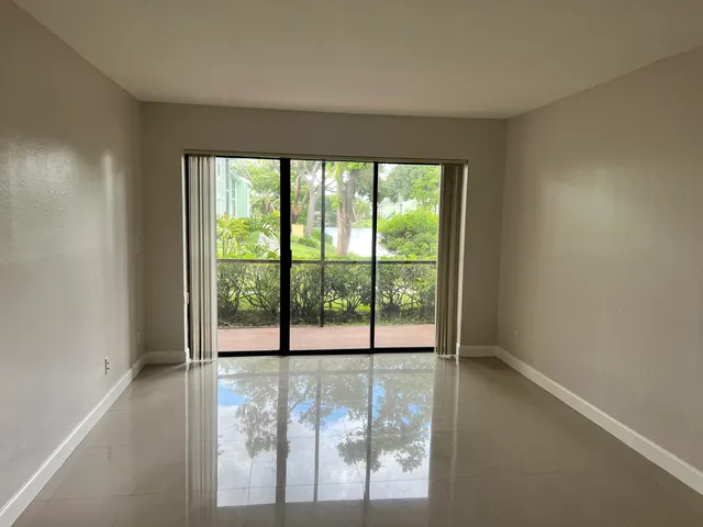 a view of a room with large windows