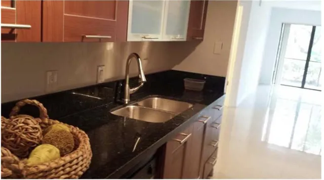 a kitchen with a sink and a window