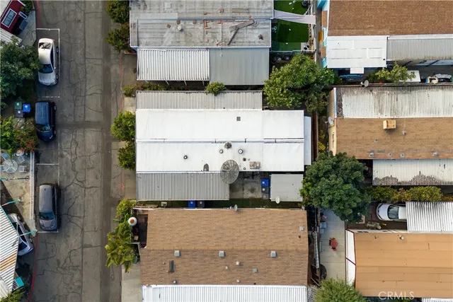 an aerial view of a city with lots of residential buildings