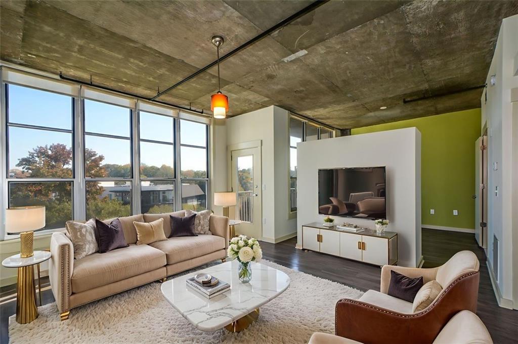 a living room with furniture and a flat screen tv