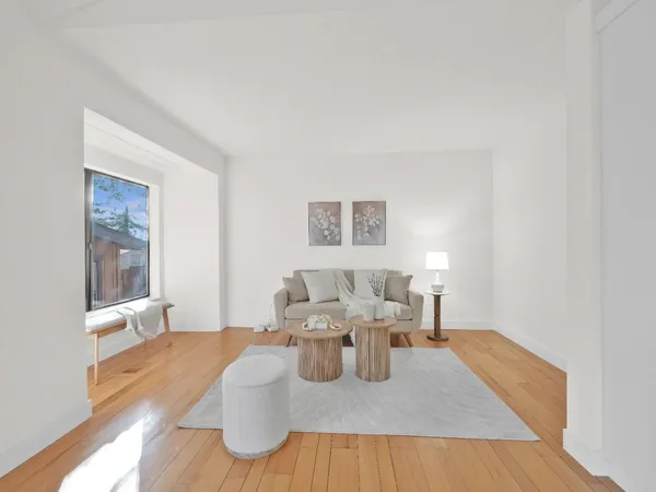 a spacious bedroom with a bed and a couch