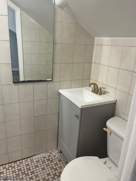 414 21st Avenue Paterson, NJ 07513 - Photo 8 of 9 a bathroom with a sink toilet and shower