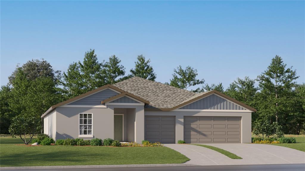 13078 Ruby Gold Court Wimauma, FL 33598 - Photo 1 of 1 a front view of a house with a yard and garage