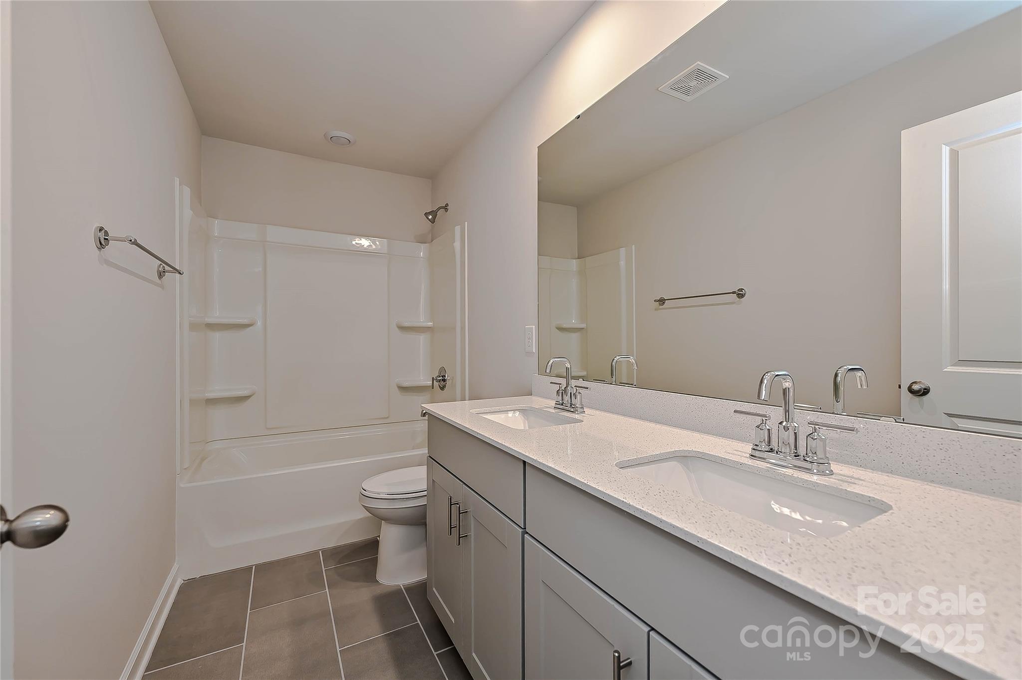 1500 31st Street Northeast Conover, NC 28613 - Photo 10 of 12 a bathroom with a granite countertop sink a toilet and shower