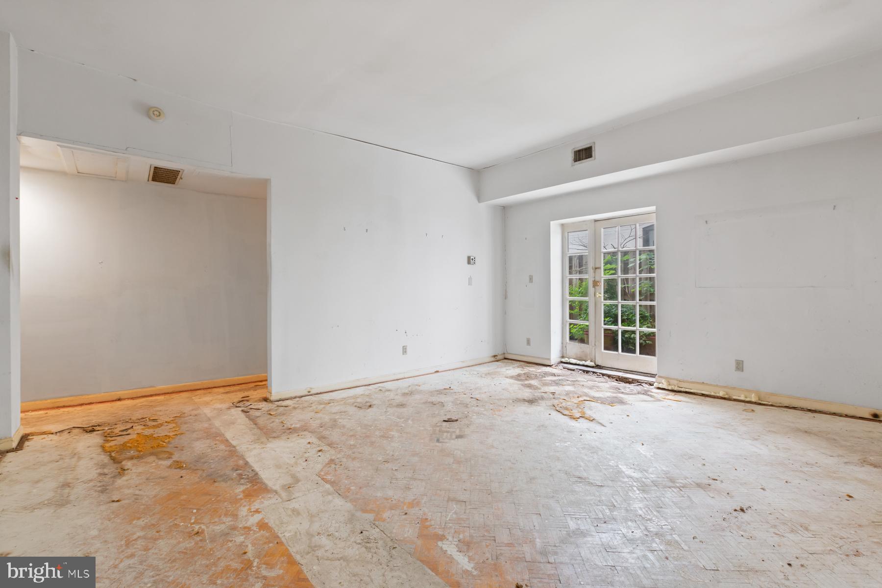 1669 Columbia Road Northwest, Unit 113 Washington, DC 20009 - Photo 3 of 25 Spacious living room accented by the french doors