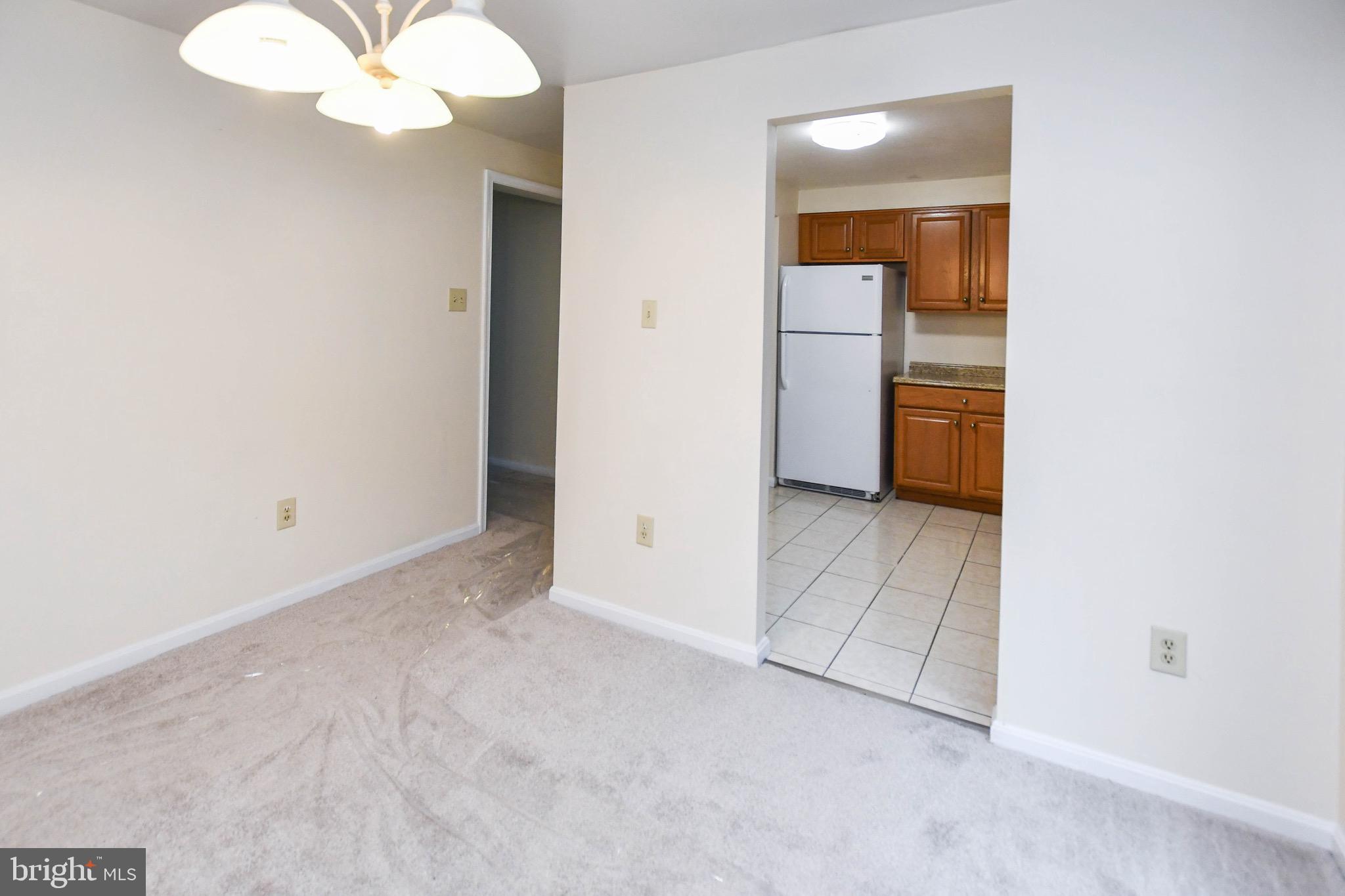 12411 Sturdee Drive Upper Marlboro, MD 20772 - Photo 15 of 39 a view of an empty room with a mirror
