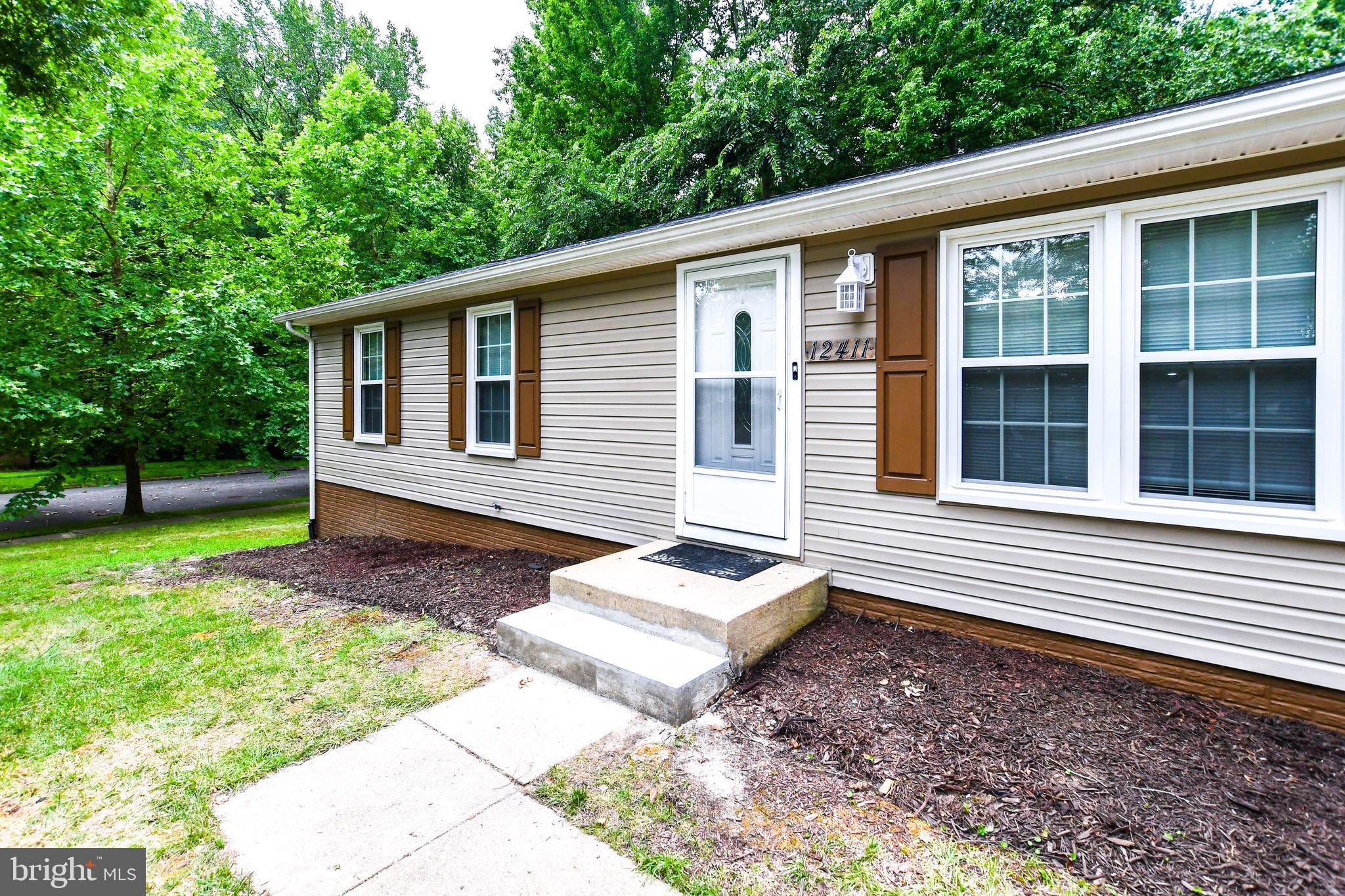 12411 Sturdee Drive Upper Marlboro, MD 20772 - Photo 2 of 39 a view of a house with a yard and sitting area