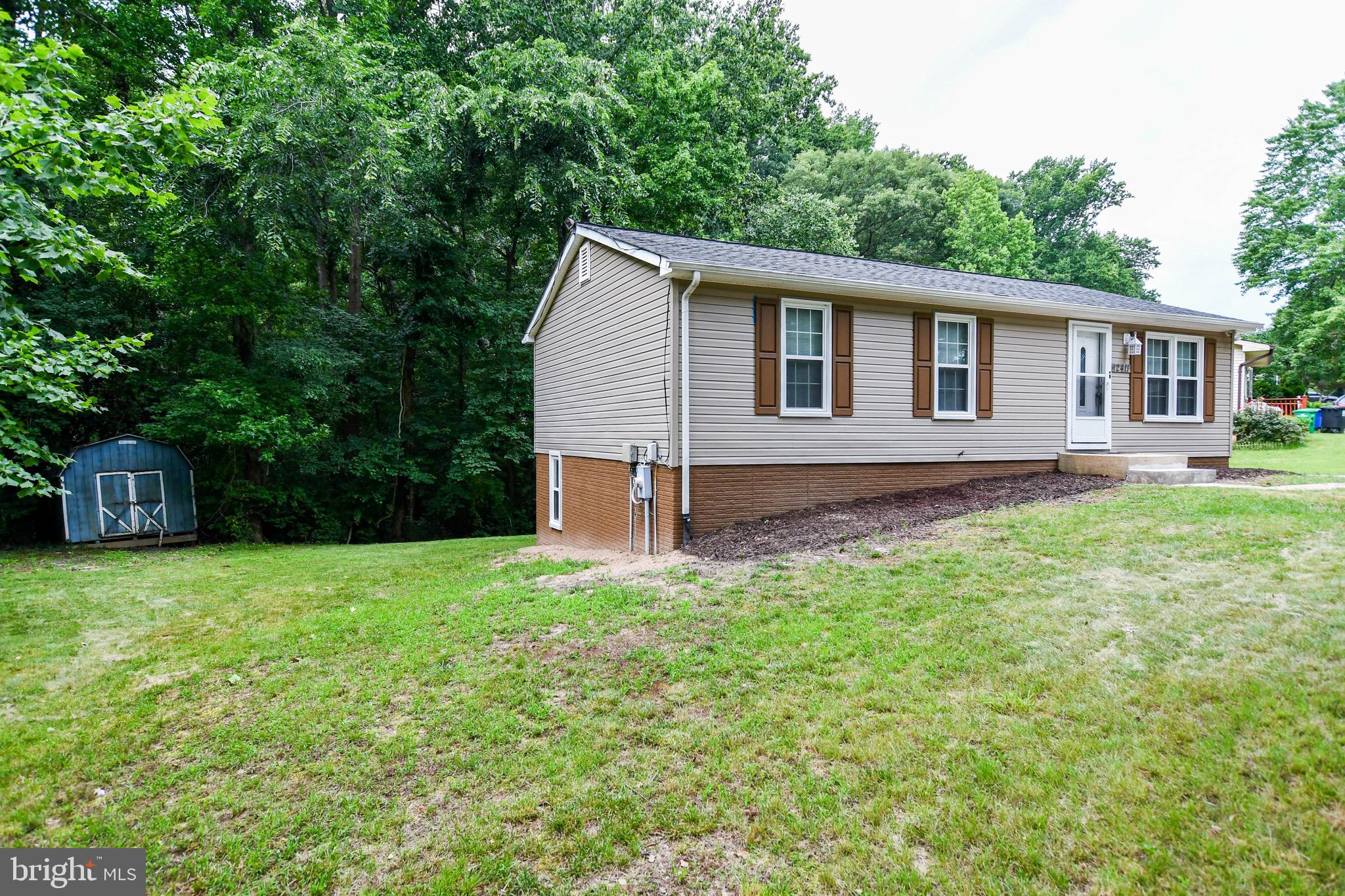 12411 Sturdee Drive Upper Marlboro, MD 20772 - Photo 3 of 39 a backyard of a house with seating space