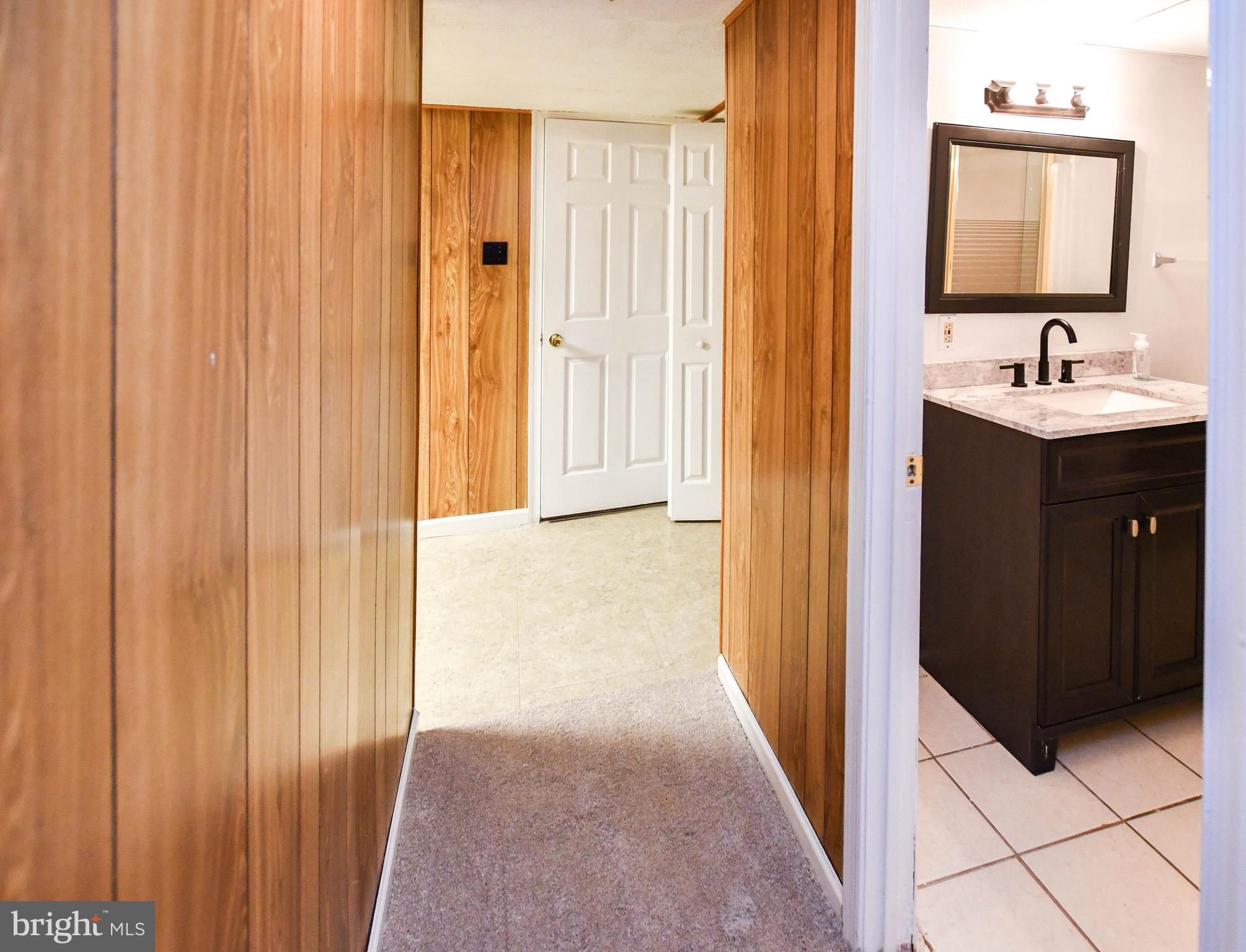 12411 Sturdee Drive Upper Marlboro, MD 20772 - Photo 33 of 39 a bathroom with a sink and a mirror