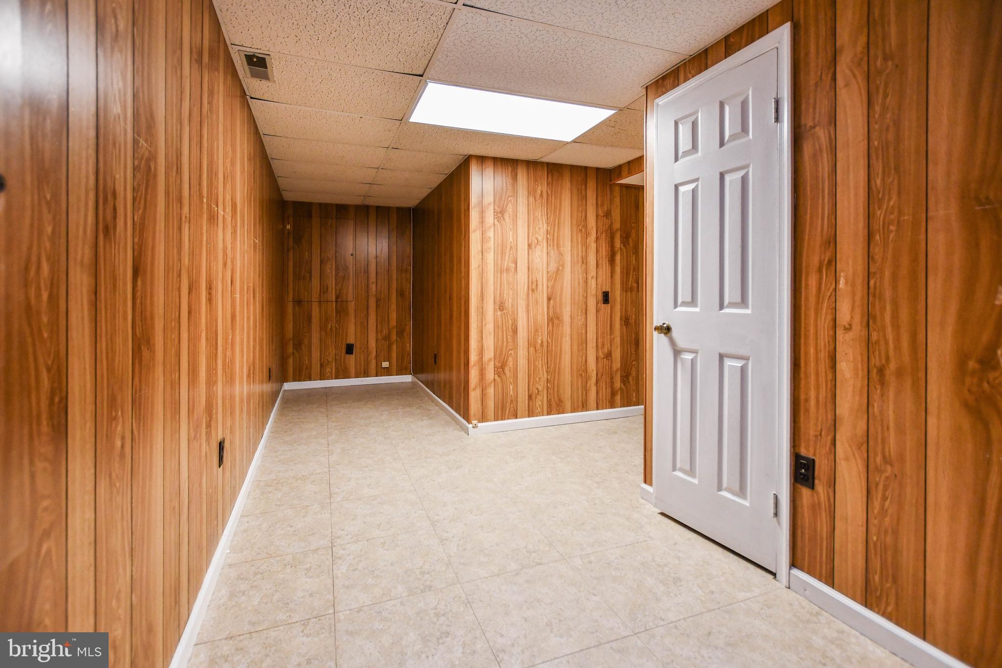 12411 Sturdee Drive Upper Marlboro, MD 20772 - Photo 34 of 39 a view of a hallway with wooden shelves